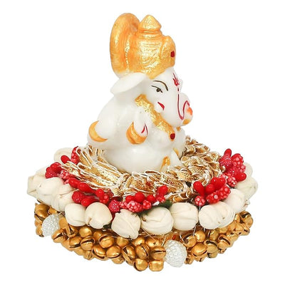 Handcrafted Ganesha idol in premium resin, weighing 240 grams, measuring 8x8x8 cm, accompanied by a plate, ideal for home altar or car décor, symbolizing wisdom and prosperity."