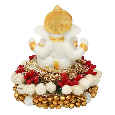 Handcrafted Ganesha idol in premium resin, weighing 240 grams, measuring 8x8x8 cm, accompanied by a plate, ideal for home altar or car décor, symbolizing wisdom and prosperity."