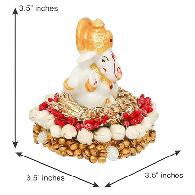Handcrafted Ganesha idol in premium resin, weighing 240 grams, measuring 8x8x8 cm, accompanied by a plate, ideal for home altar or car décor, symbolizing wisdom and prosperity."