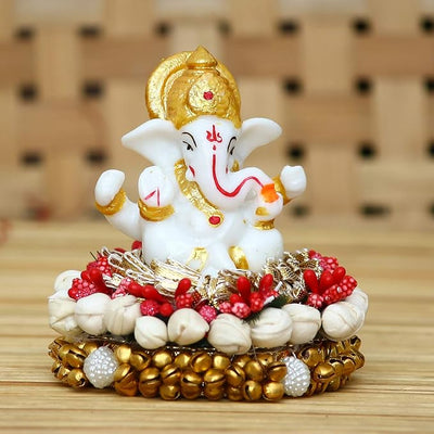 Handcrafted Ganesha idol in premium resin, weighing 240 grams, measuring 8x8x8 cm, accompanied by a plate, ideal for home altar or car décor, symbolizing wisdom and prosperity."