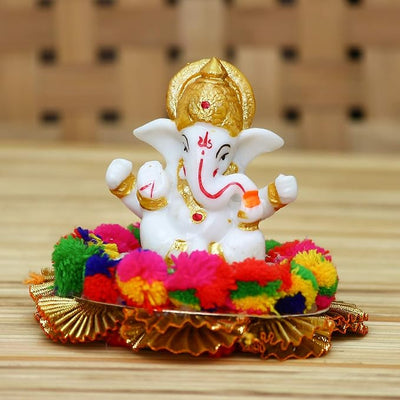 Handmade Ganesha idol crafted from premium resin, weighing 400 grams, measuring 10.2x10.2x8.6 cm, accompanied by a plate, perfect for home altar or car décor, symbolizing wisdom and prosperity."