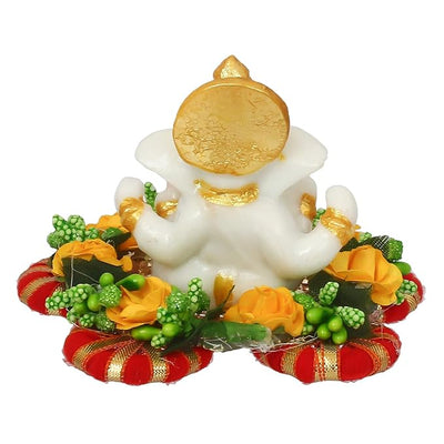 Handmade Ganesha idol crafted from premium resin, weighing 400 grams, measuring 11x11x7 cm, accompanied by a plate, ideal for home altar or car décor, symbolizing wisdom and prosperity."