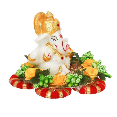 Handmade Ganesha idol crafted from premium resin, weighing 400 grams, measuring 11x11x7 cm, accompanied by a plate, ideal for home altar or car décor, symbolizing wisdom and prosperity."