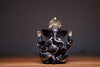 Handcrafted Ganesha idol made of resin, designed for car dashboards, featuring intricate details and vibrant colors.