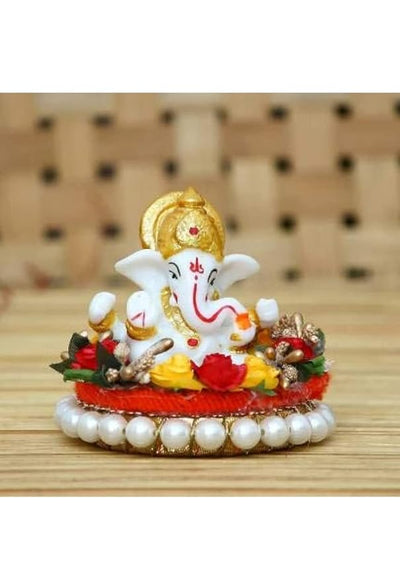 Handcrafted Ganesha idol made of durable polyresin, measuring 9 cm x 8 cm x 5 cm and weighing 300 grams, symbolizing wisdom and prosperity