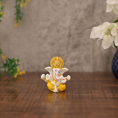 Handcrafted resin Ganesha idol measuring 7x7x3 cm, ideal for car dashboards, home decor, and gifting.