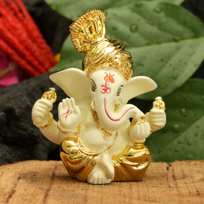 Handcrafted gold-plated Ganesha idol made from ceramic, symbolizing prosperity and positivity, perfect for home decor and altars.