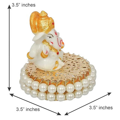 Handcrafted Lord Ganesha idol made of resin, dimensions 8.9 x 8.9 x 8.9 cm, weighing 400 grams, perfect for home and car decor.