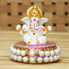 Handcrafted Lord Ganesha idol made of resin, dimensions 8.9 x 8.9 x 8.9 cm, weighing 400 grams, perfect for home and car decor.