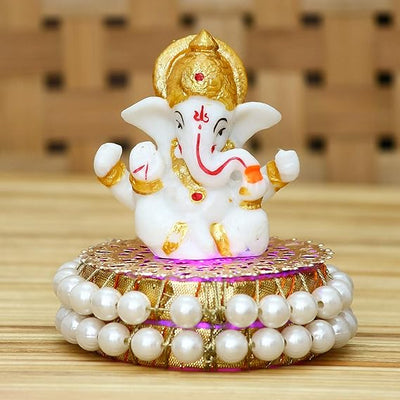 Handcrafted Lord Ganesha idol made of resin, dimensions 8.9 x 8.9 x 8.9 cm, weighing 400 grams, perfect for home and car decor.