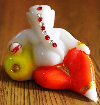 Handcrafted Lord Ganesha idol made of resin, ideal for home decor, car dashboards, and gifting. Symbol of wisdom and prosperity.