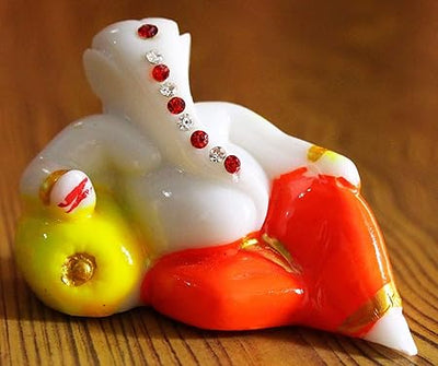 Handcrafted Lord Ganesha idol made of resin, ideal for home decor, car dashboards, and gifting. Symbol of wisdom and prosperity.