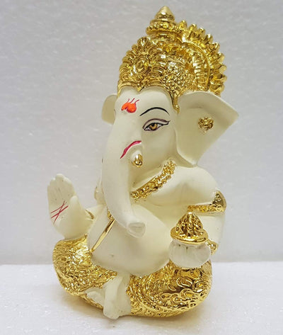 Handcrafted Ganesha idol in gold/silver plating, measuring 4L x 5W x 8.9H cm, symbolizing success and wisdom for your home or car.