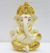 Handcrafted Ganesha idol in gold/silver plating, measuring 4L x 5W x 8.9H cm, symbolizing success and wisdom for your home or car.