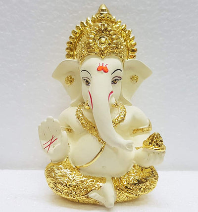 Handcrafted Ganesha idol in gold/silver plating, measuring 4L x 5W x 8.9H cm, symbolizing success and wisdom for your home or car.