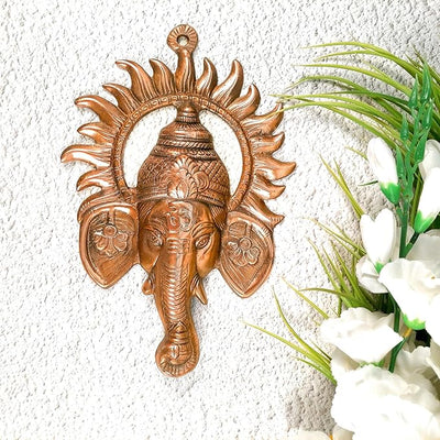 Handmade aluminum Ganesha idol, perfect for altar or wall hanging, symbolizing prosperity and blessings.