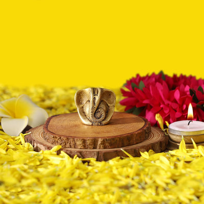 Handcrafted Baby Ganesha idol in pure brass, measuring 4 cm x 1 cm x 3.3 cm, symbolizing prosperity and fresh starts, ideal for any altar.