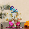 "Handmade ceramic Ganesha idol, beautifully crafted, ideal for dashboard decoration, symbolizing wisdom and protection."