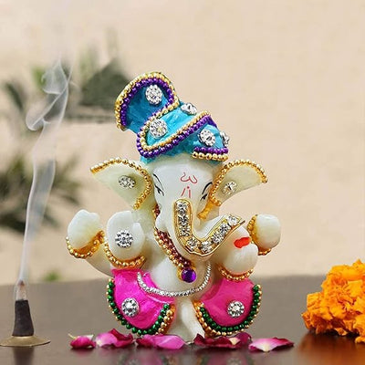 "Handmade ceramic Ganesha idol, beautifully crafted, ideal for dashboard decoration, symbolizing wisdom and protection."