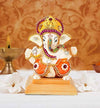 "Handmade ceramic Ganesha idol designed for car dashboard decor, symbolizing wisdom, prosperity, and protection during travels."