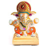 "Handmade ceramic Ganesha idol designed for car dashboard decor, symbolizing wisdom, prosperity, and protection during travels."