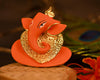 Handmade ceramic Ganesha idol for car dashboard or altar, symbolizing wisdom and prosperity. Compact and beautifully crafted for home décor and gifting."