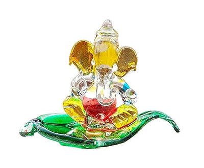 Handmade crystal glass Ganesha idol for car dashboard, showcasing intricate design and spiritual elegance