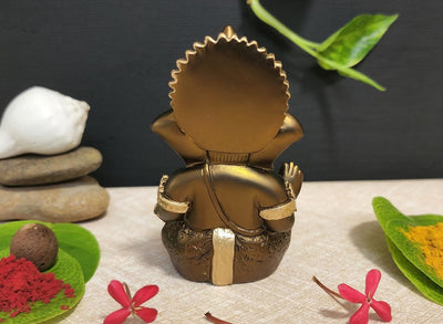 Handmade French Brown Ganesha idol with golden accents, symbolizing prosperity and new beginnings, perfect for home or office decor.