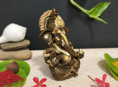 Handmade French Brown Ganesha idol with golden accents, symbolizing prosperity and new beginnings, perfect for home or office decor.