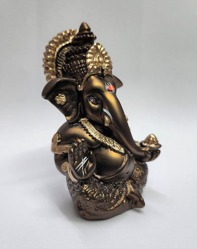 Handmade French Brown Ganesha idol with golden accents, symbolizing prosperity and new beginnings, perfect for home or office decor.
