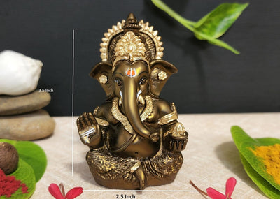 Handmade French Brown Ganesha idol with golden accents, symbolizing prosperity and new beginnings, perfect for home or office decor.