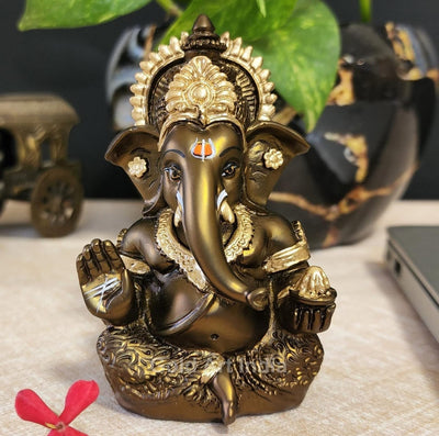 Handmade French Brown Ganesha idol with golden accents, symbolizing prosperity and new beginnings, perfect for home or office decor.