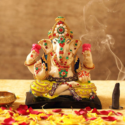 Handmade polyresin Ganesh idol showcasing intricate details and vibrant colors, symbolizing joy and prosperity. Perfect for home decor or altars."