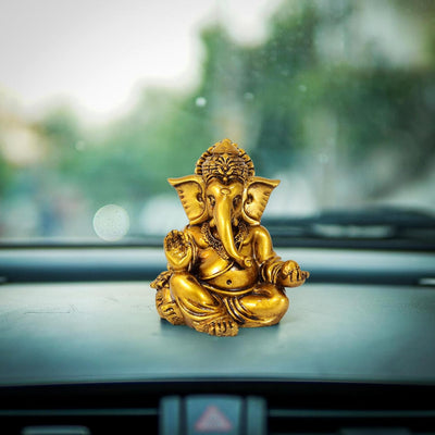 Handmade Ganesha idol for car dashboard, crafted from resin, 5 cm tall, designed to bring blessings and protection on the road