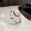 "Handmade Ganesha idol in glass, designed for car dashboards, featuring intricate details and a sleek finish for spiritual protection on the road."