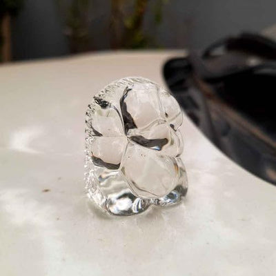 "Handmade Ganesha idol in glass, designed for car dashboards, featuring intricate details and a sleek finish for spiritual protection on the road."