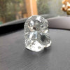 "Handmade Ganesha idol in glass, designed for car dashboards, featuring intricate details and a sleek finish for spiritual protection on the road."