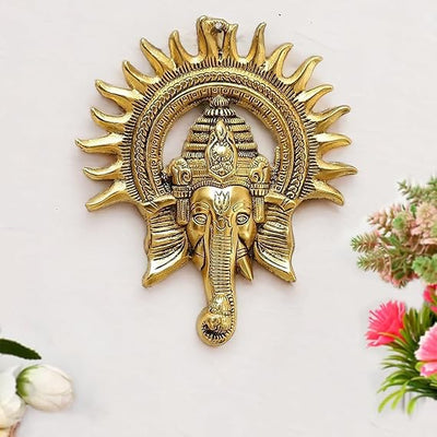 "Handmade Ganesha idol in metal, showcasing intricate craftsmanship and design, perfect for wall hanging or home altar decoration."