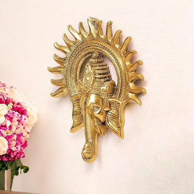 "Handmade Ganesha idol in metal, showcasing intricate craftsmanship and design, perfect for wall hanging or home altar decoration."