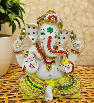 Handmade Ganesha idol, 14 cm tall, crafted from plastic, featuring vibrant colors and intricate details, perfect for home altar decor.