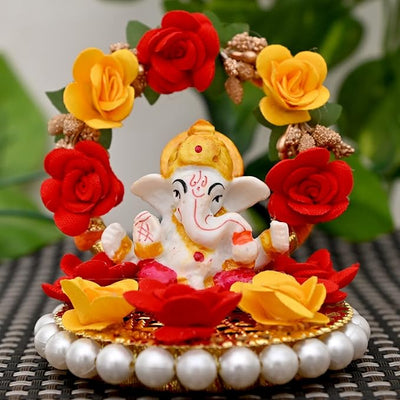 Handmade Ganesha idol crafted from high-quality resin, featuring intricate details, perfect for home and car decoration, symbolizing prosperity and wisdom.