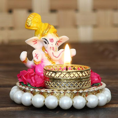 Handmade Ganesha idol made from durable resin, weighing 300 grams, measuring 8.5x7x8.5 cm, ideal for home altar or car décor, symbolizing wisdom and prosperity."