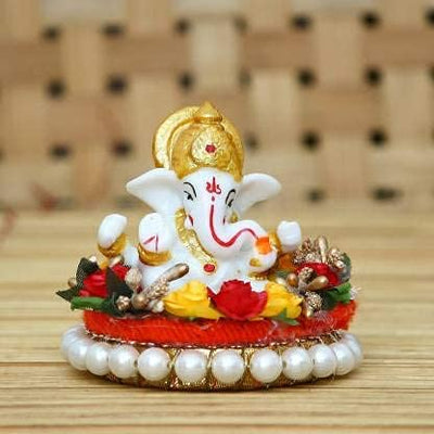Handmade Ganesha idol made from durable resin, weighing 400 grams, measuring 5x4x8 cm, perfect for home altar or car décor, symbolizing wisdom and prosperity."
