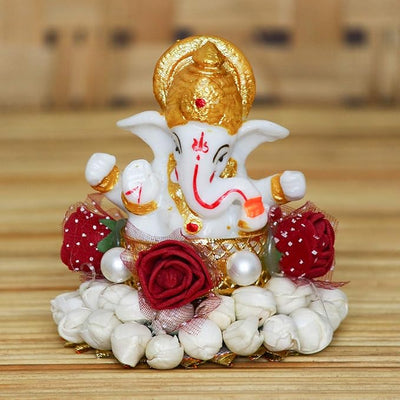 Handmade Ganesha idol crafted from durable resin, weighing 400 grams, measuring 8x8x8 cm, ideal for home altar or car décor, symbolizing wisdom and prosperity.
