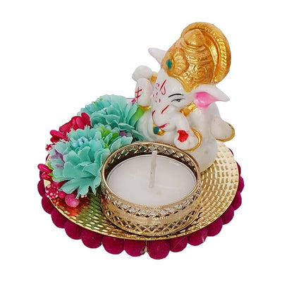 Handmade Ganesha idol made from resin, featuring intricate details and vibrant colors, ideal for home altars and car dashboards, measuring 9 cm x 9 cm x 7.5 cm