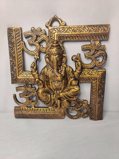 Handmade aluminum Ganesha idol, wall hanging, showcasing intricate craftsmanship and vibrant design.