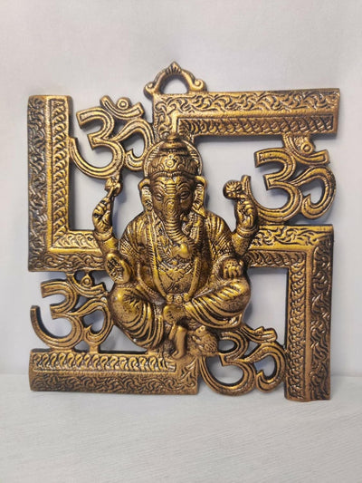 Handmade aluminum Ganesha idol, wall hanging, showcasing intricate craftsmanship and vibrant design.