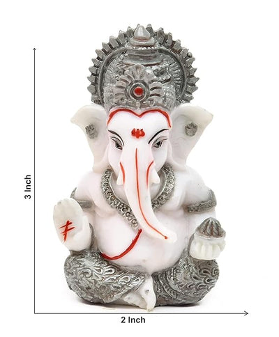 Handmade Ganesha idol in resin for car dashboard, measuring 5.1 cm x 5.1 cm x 7.6 cm, ideal for bringing blessings and positivity while driving
