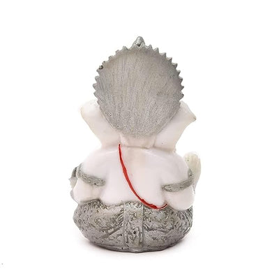 Handmade Ganesha idol in resin for car dashboard, measuring 5.1 cm x 5.1 cm x 7.6 cm, ideal for bringing blessings and positivity while driving