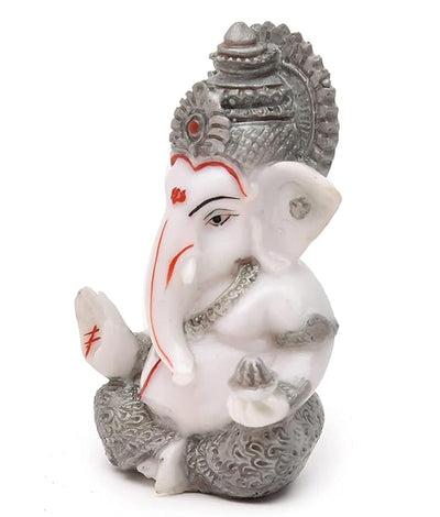 Handmade Ganesha idol in resin for car dashboard, measuring 5.1 cm x 5.1 cm x 7.6 cm, ideal for bringing blessings and positivity while driving